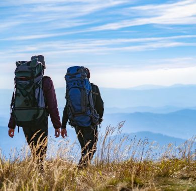 The two people walking on the mountain